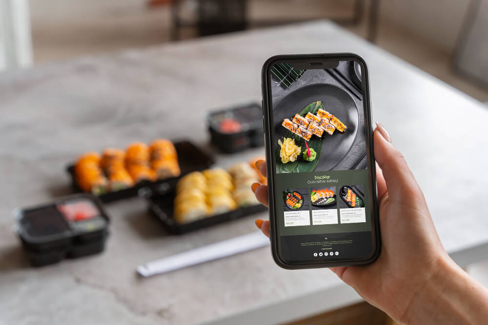 Modern restaurant website displayed on desktop showing food menu and online ordering features
